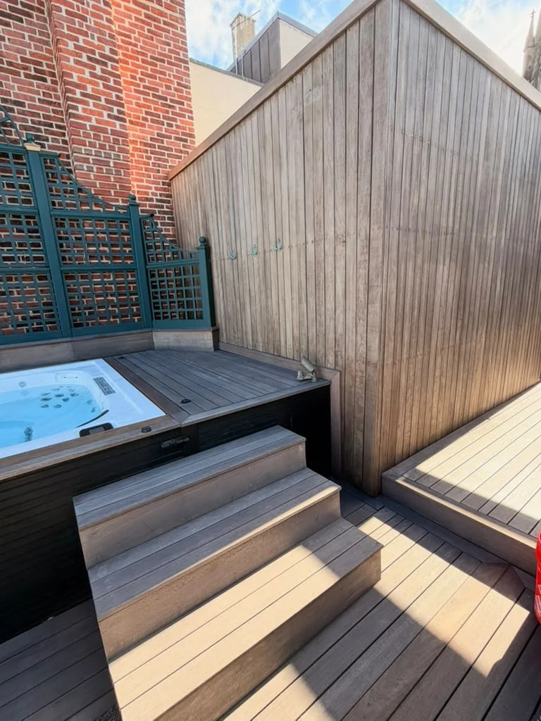 After: sealed mahogany privacy screen and hot tub steps on a Back Bay, Boston rooftop deck