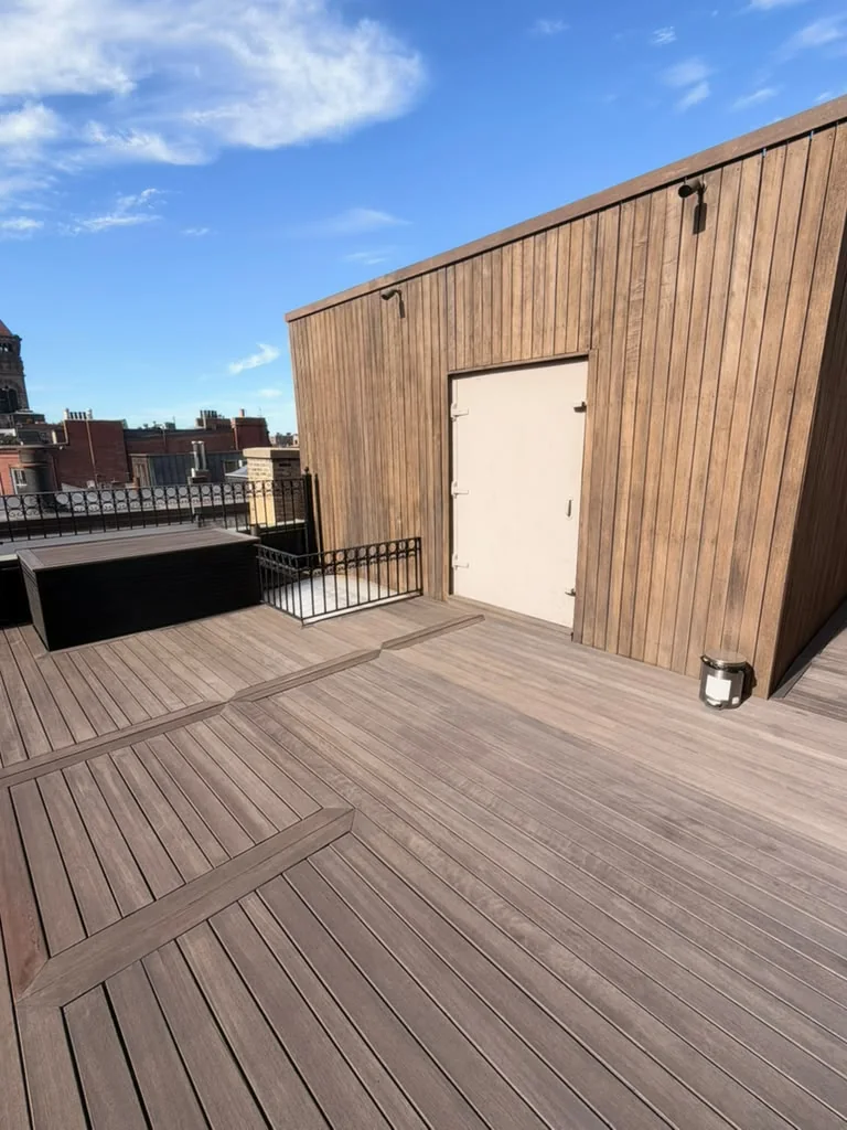 Finished: sealed mahogany wall around the roof access door and the decking in front of it, by ALP Home Services